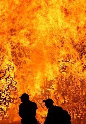 In 1690, the army of King William III of Orange vanquished that of Catholic King James II at the Boyne River in the present day Irish Republic. The Protestant British monarchy was born. On the night of July 11, Protestants celebrate with bonfires such as this one in the Shankill Road area of West Belfast, Northern Ireland. On Thursday, parades occurred throughout Northern Ireland, the largest of which traversed the Catholic neighborhood of the Ardoyne in Belfast. It was the most peaceful July 12 in decades.