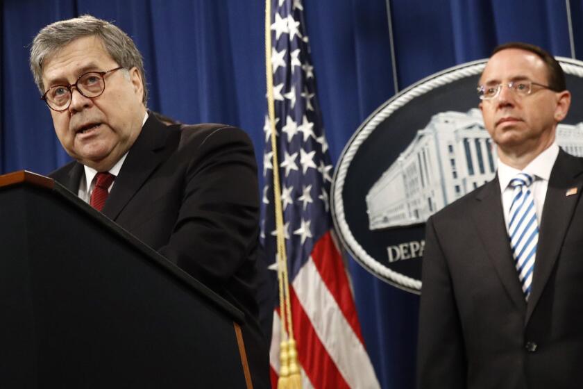 Attorney General William Barr speaks alongside Deputy Attorney General Rod Rosenstein about the release of a redacted version of special counsel Robert Mueller's report during a news conference, Thursday, April 18, 2019, at the Department of Justice in Washington. (AP Photo/Patrick Semansky)