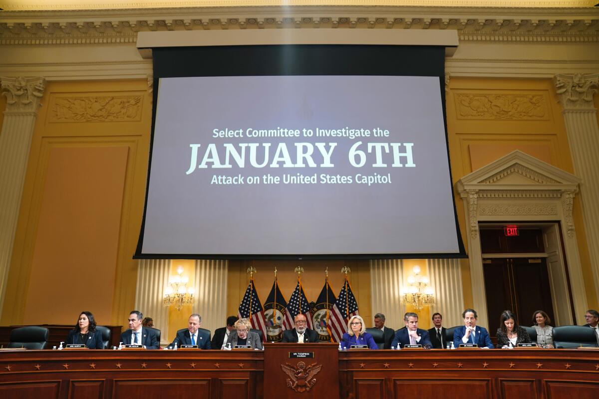 The House Jan. 6 committee sits in session in front of a large video screen