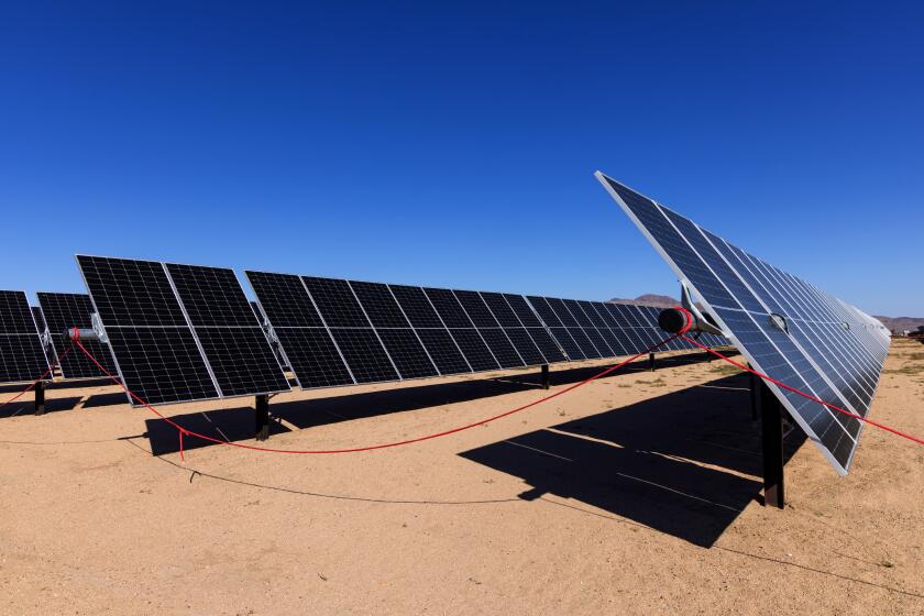 DAGGETT, CA - OCTOBER 18: Solar farm at Daggett 3 Solar Power + Battery Energy Storage System Clearway Solar + Energy Storage on Wednesday, Oct. 18, 2023 in Daggett, CA. (Irfan Khan / Los Angeles Times)