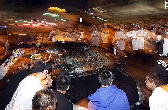 Lakers fans destroy car