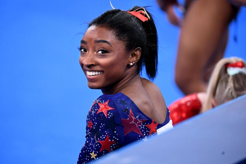-TOKYO,JAPAN July 24, 2021: USA's Simone Biles smiles in between sessions in the women's team qualifying at the 2020 Tokyo Olympics. (Wally Skalij /Los Angeles Times)