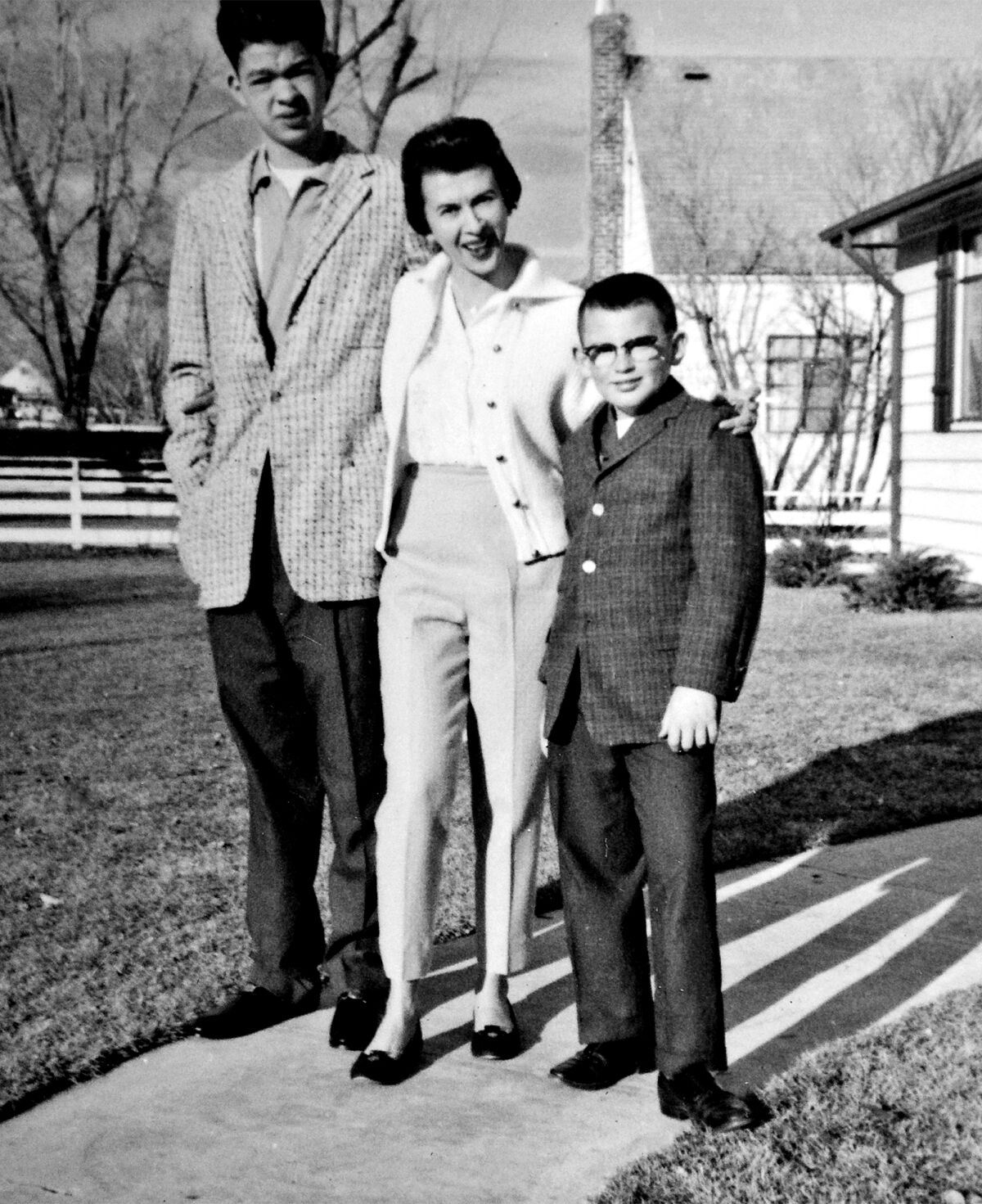 The Trimble boys posed outside with their mother 