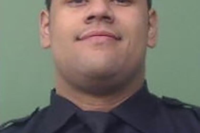 In an undated photo released by the NYPD, New York Police Department officer Wilbert Mora who was involved in a police shooting, Friday, Jan. 21, 2022, in New York City, is seen. Officials say Mora, 27 years old, was critically wounded while fellow officer Jason Rivera, 22 years old, was killed in a shooting in Harlem. The officers had been responding to a call Friday about an argument between a woman and her adult son. (NYPD via AP Photo)