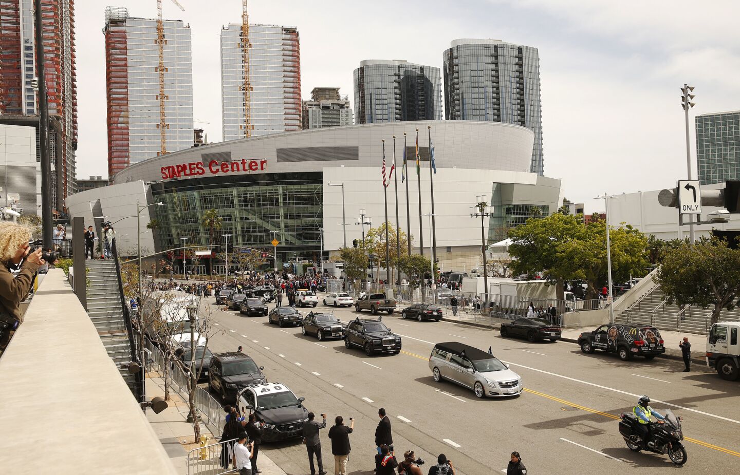Fans line the street outside Staples Center as Nipsey Hussle's funeral procession departs.