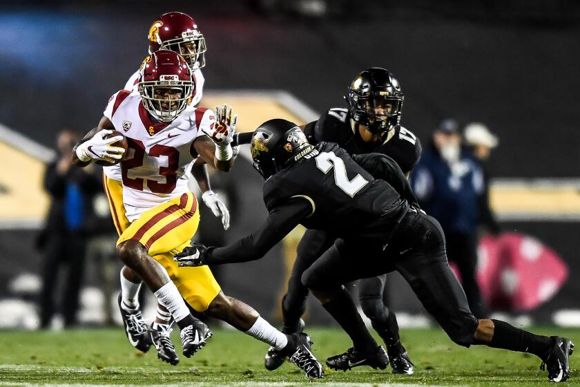 BOULDER, CO - OCTOBER 25: Kenan Christon #23 of the USC Trojans carries the ball against the Colorado Buffaloes in the first quarter of a game at Folsom Field on October 25, 2019 in Boulder, Colorado. (Photo by Dustin Bradford/Getty Images)
