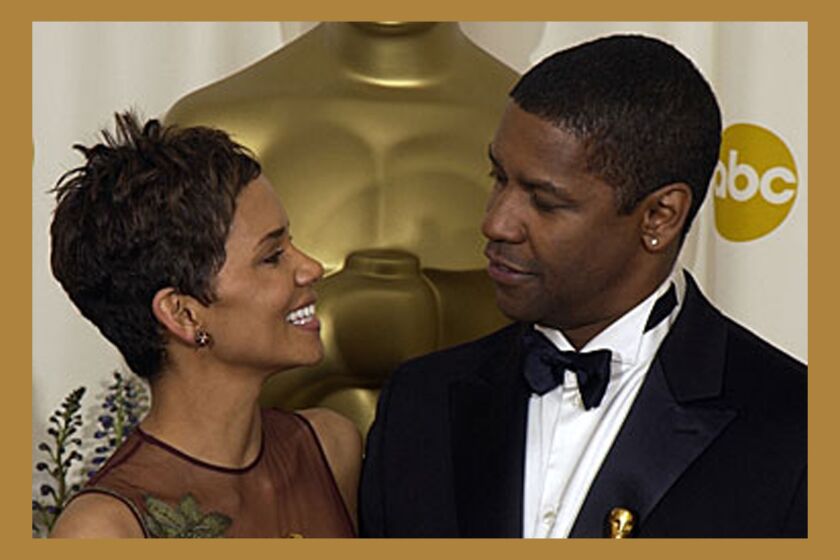 Denzel Washington won the Oscar for best actor award and Halle Berry won for best actress.