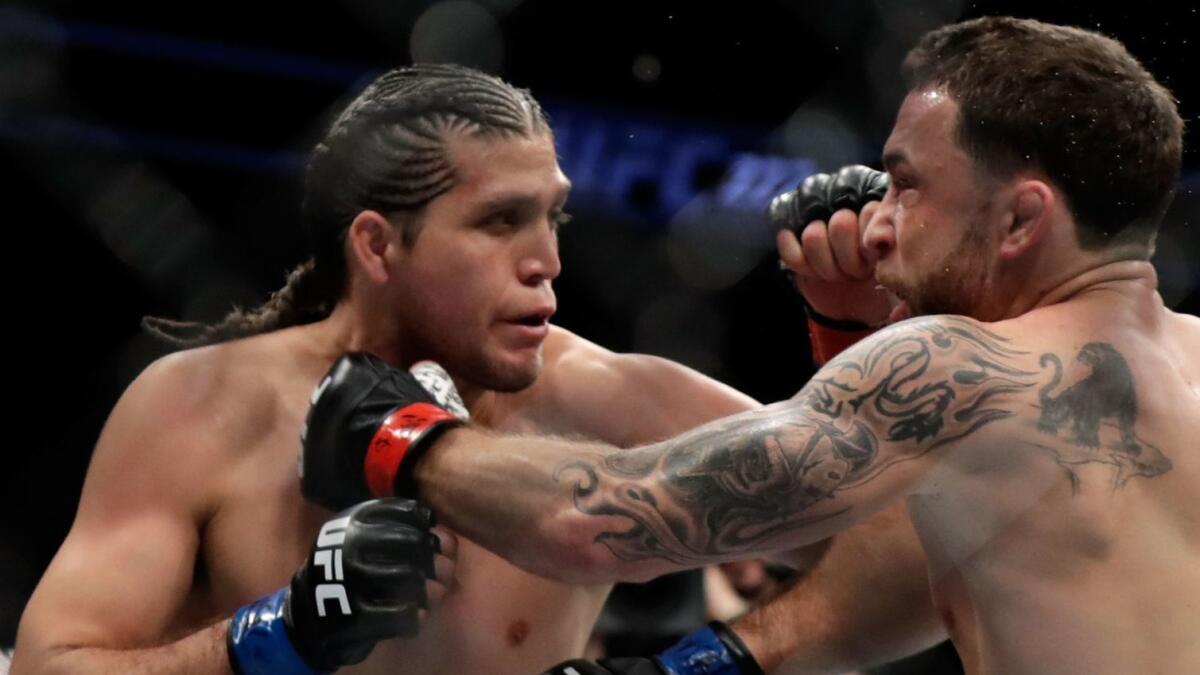 Brian Ortega, right, fights Frankie Edgar during UFC 222 on March 3 in Las Vegas.