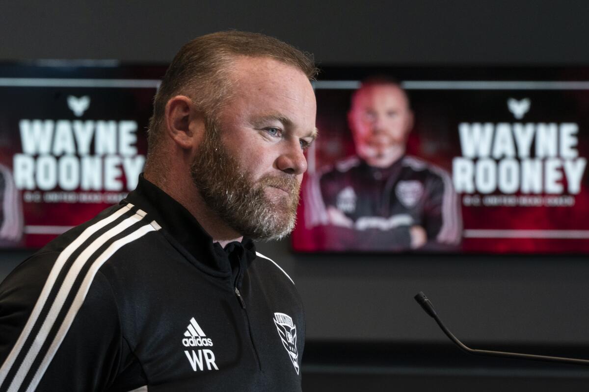 Wayne Rooney pauses while speaking during a news conference to announce him as the new head coach of MLS soccer club D.C. United, Tuesday, July 12, 2022, in Washington. (AP Photo/Alex Brandon)