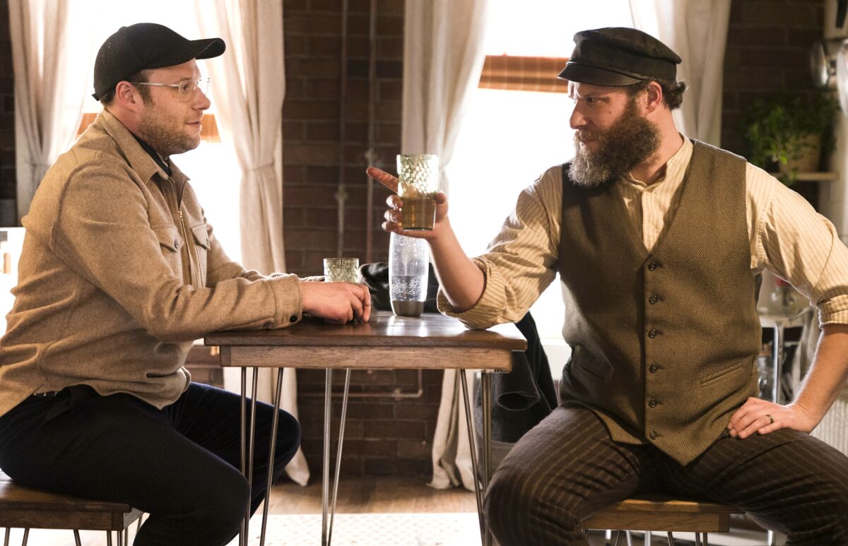 This image released by HBO Max shows Seth Rogen portraying Ben Greenbaum, left, and Herschel Greenbaum in a scene from "An American Pickle." (Hopper Stone/HBO Max via AP)