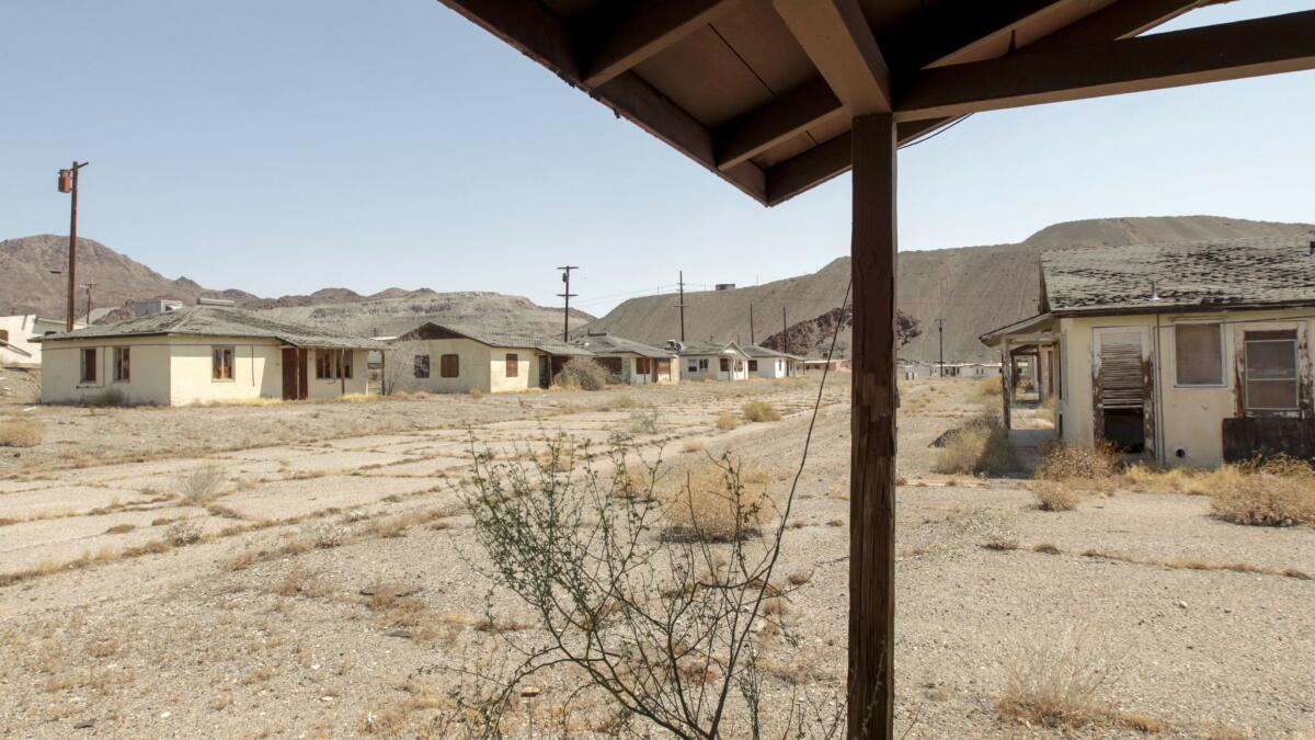Weed-filled streets and boarded-up houses are all that is left of the company town. (Irfan Khan / Los Angeles Times)