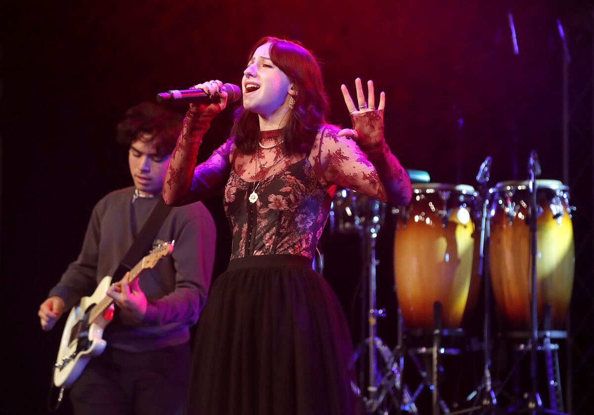 Singer Bria Linnborn rehearses for "Playlist" at a tech rehearsal on Monday.
