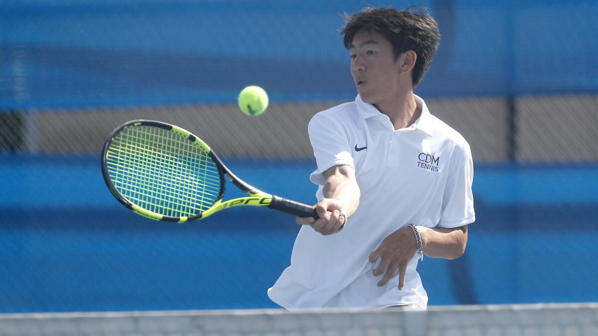 Corona del Mar High senior Kyle Pham, shown in action against Fountain Valley on March 26, earned all-tournament team honors at the National High School Tennis All-American Invitational.