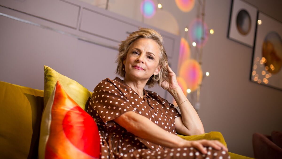 Amy Sedaris lounges on a couch at a home decor store in New York City. Sedaris stars in the TruTV comedy “At Home With Amy Sedaris,” a sketch-comedy show loosely based on her off-kilter how-to books.
