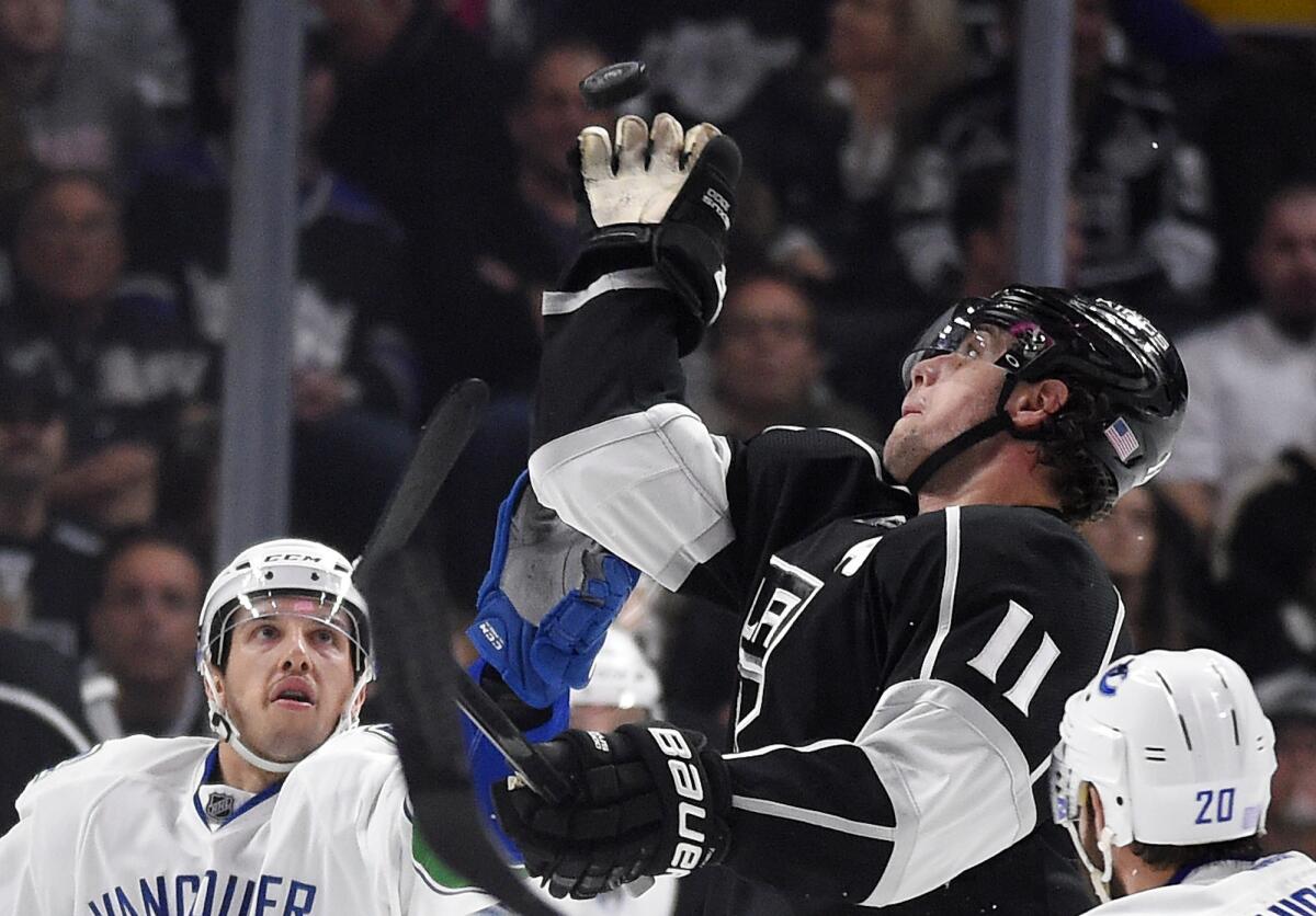 Anze Kopitar, center, was one of five Kings players to score a goal Saturday during a 5-1 victory over Vancouver at Staples Center.
