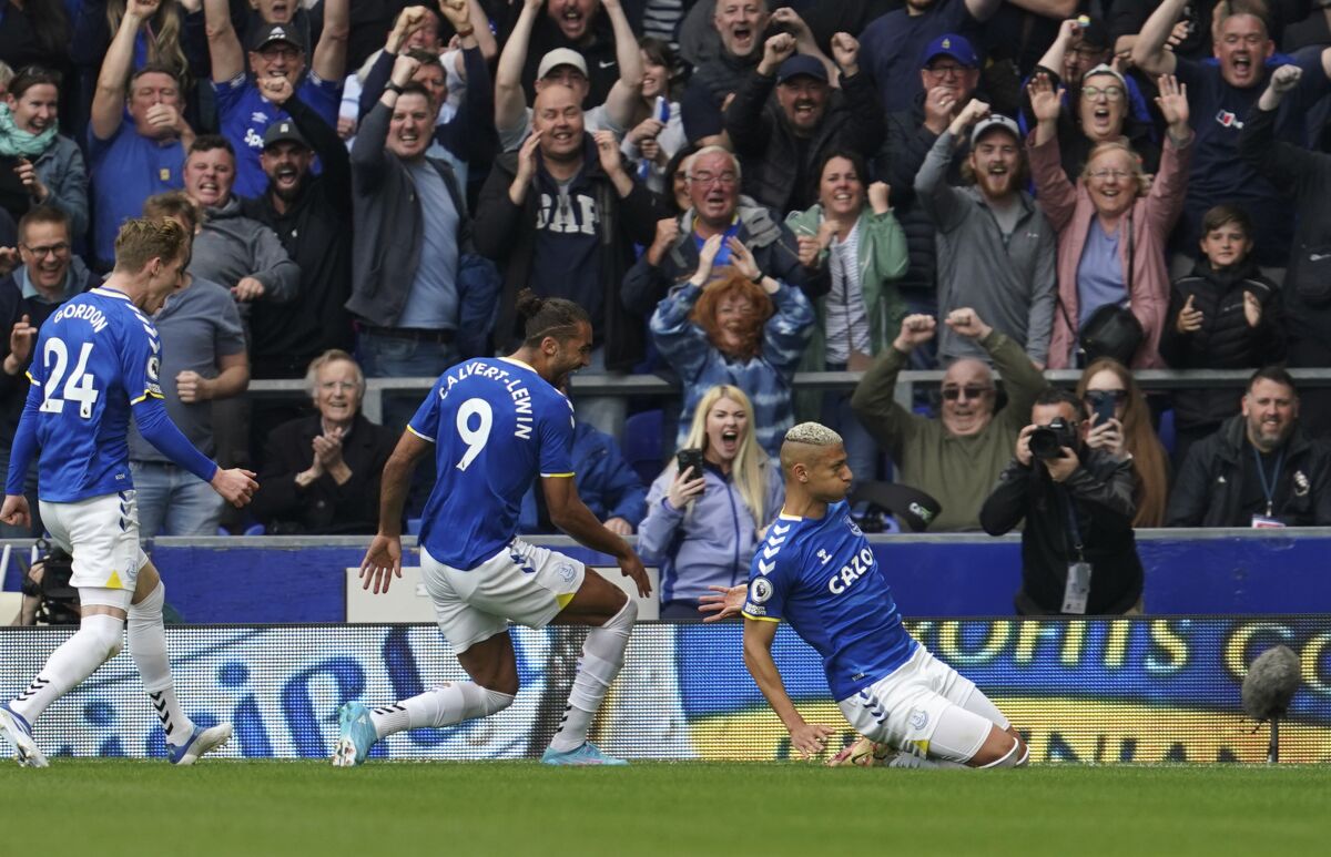 Everton's Richarlison, right, celebrates after scoring his side's second goal during the Premier League soccer match between Everton and Brentford at Goodison Park in Liverpool, England, Sunday, May 15, 2022. (AP Photo/Jon Super)