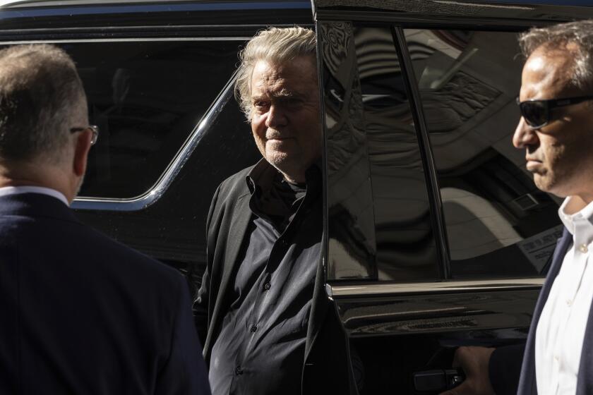 Former White House strategist Steve Bannon, arrives at court, Thursday, Sept. 8, 2022, in New York. Bannon surrendered to New York authorities, and is expected to be charged in border wall scheme. (AP Photo/Yuki Iwamura)