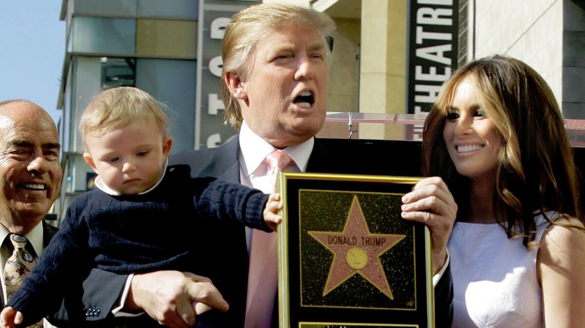 Donald Trump and his wife, Melania, and their son, Barron, posed for a photo after he was given a star on the Hollywood Walk of Fame in 2007.