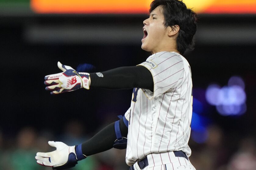 Japan's Shohei Ohtani celebrates after a double during the ninth inning of a World Baseball Classic game against Mexico, Monday, March 20, 2023, in Miami. (AP Photo/Wilfredo Lee)