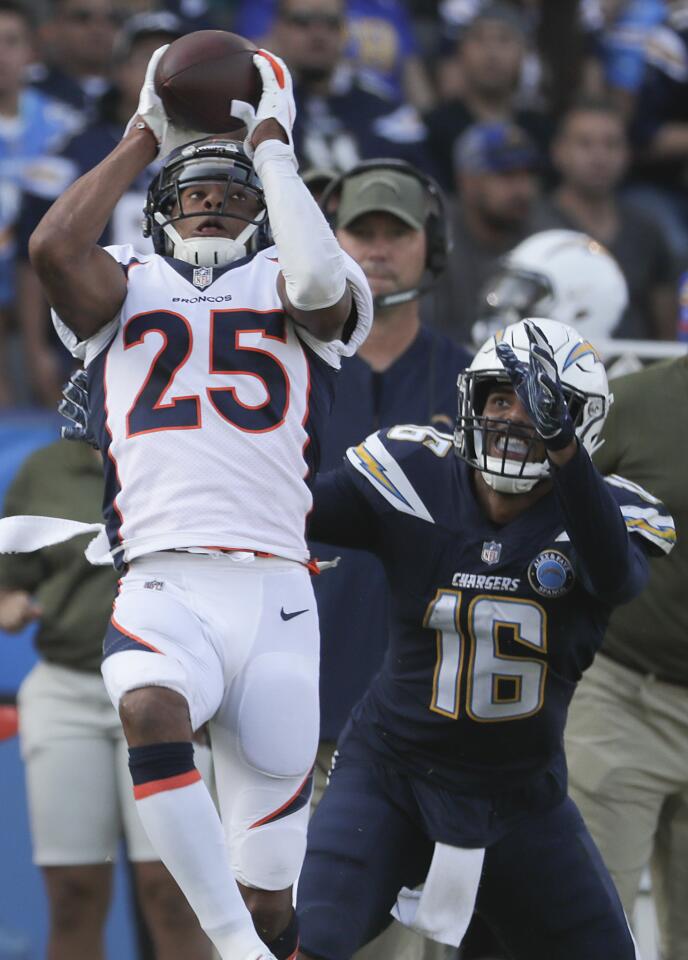 Denver Broncos cornerback Chris Harris Jr. intercepts a pass intended for Chargers receiver Tyrell Williams during second half action at Stubhub Center on Sunday.