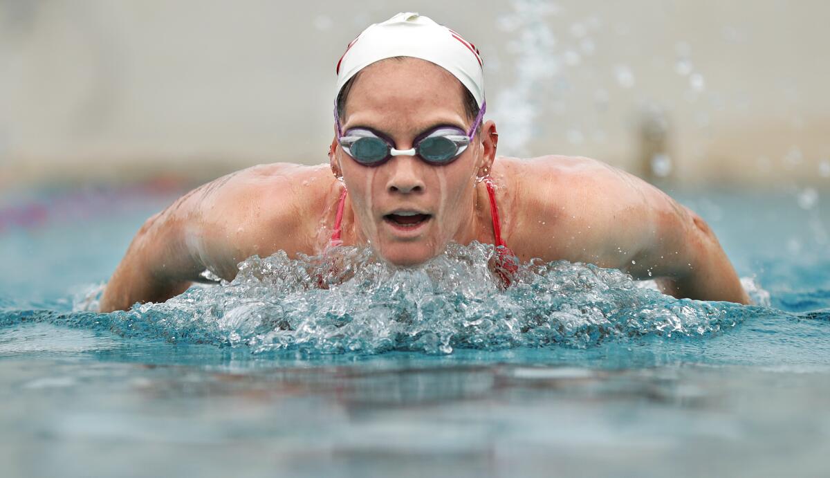 Alys Williams of the U.S. women's Olympic water polo team swims in goggles and cap.
