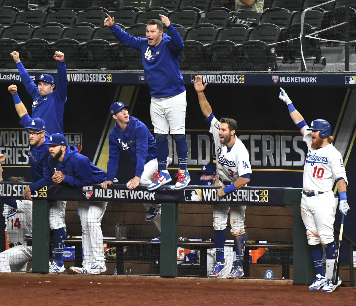 The Dodgers dugout erupts on a home run by Mookie Betts in the sixth inning against the Rays in Game 1.