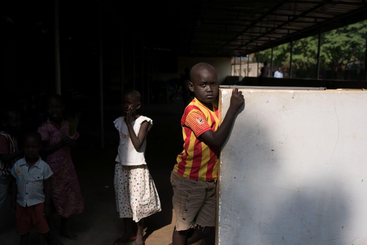 Families seek shelter from fighting in a church compound in Juba