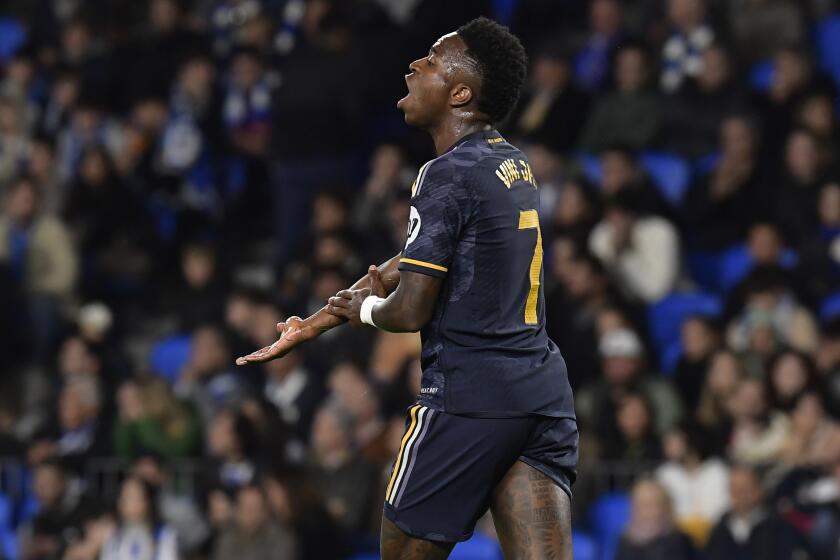 Real Madrid's Vinicius Junior reacts during the Spanish La Liga soccer match between Real Sociedad and Real Madrid in San Sebastian, Spain, Friday, April 26, 2024. (AP Photo/Alvaro Barrientos)