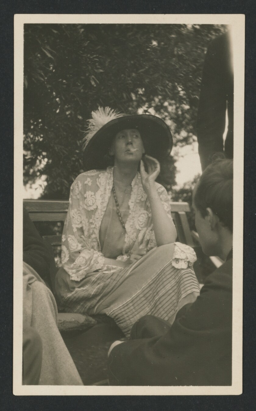 Virginia Woolf enjoying a smoke in Garsington, England, 1923.