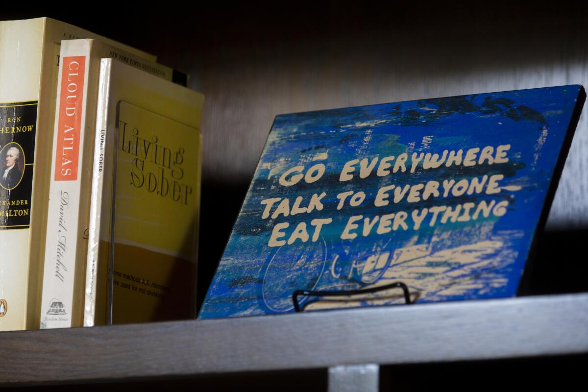 "Go everywhere talk to everyone Eat Everything" sign inside Krista Vernoff's home office