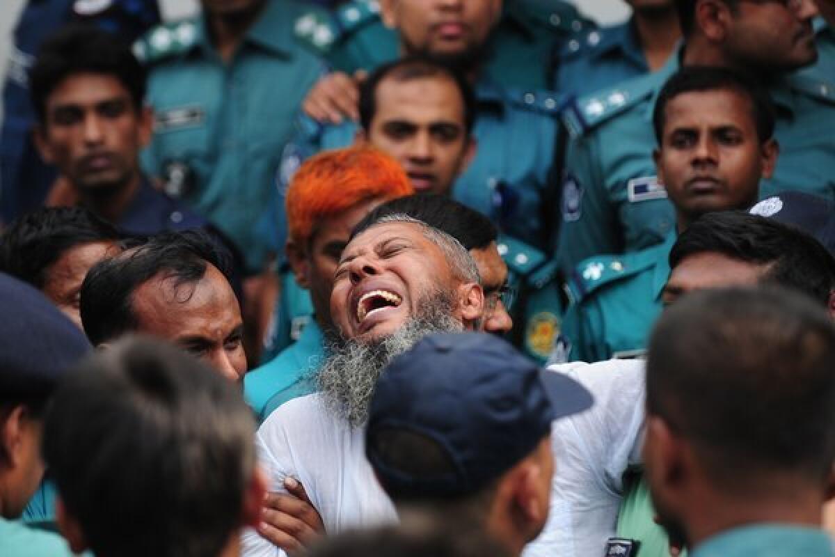 An ex-paramilitary soldier reacts following the announcement of his death sentence at a special court in Bangladesh's capital, Dhaka.