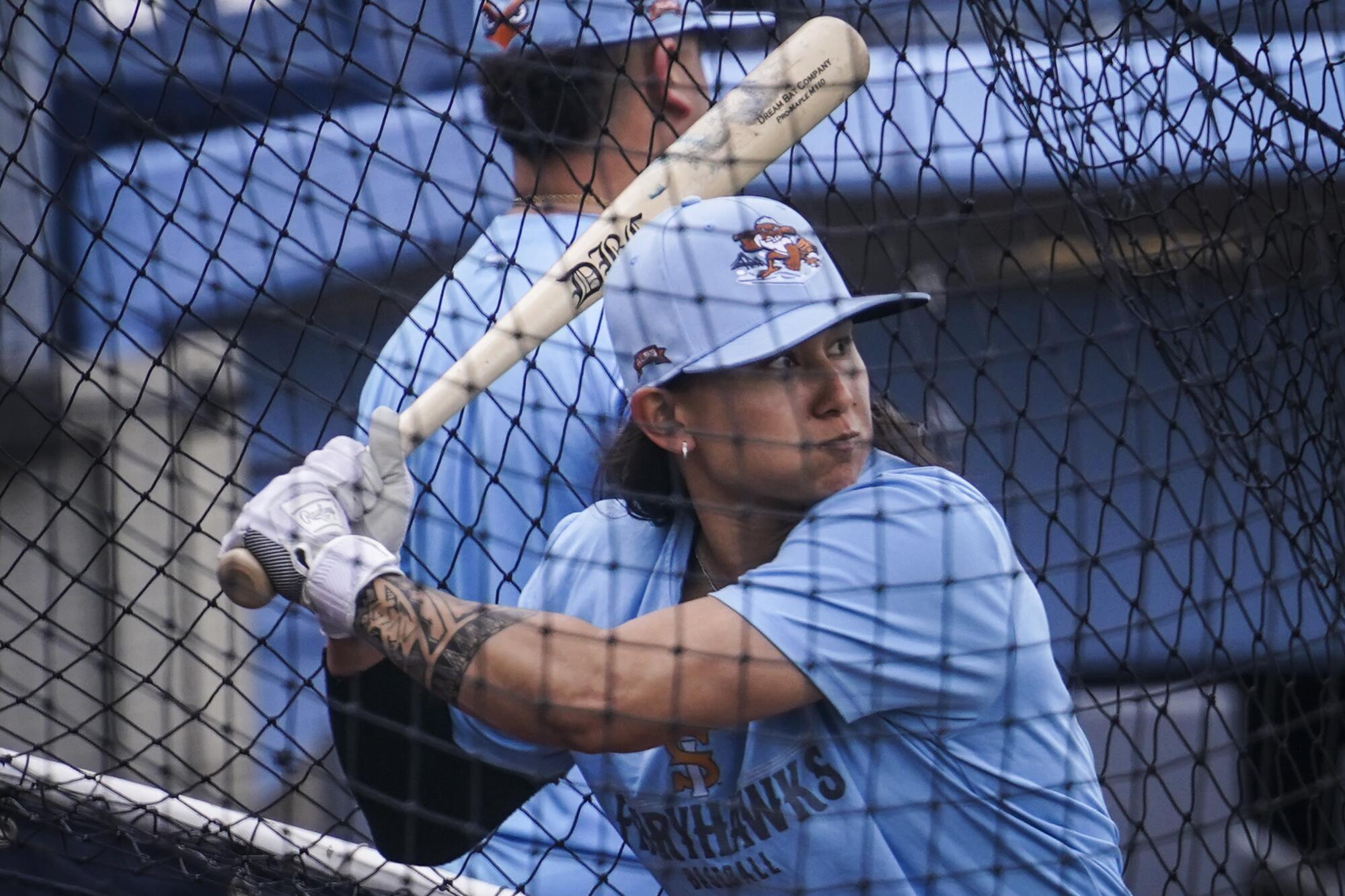 Kelsie Whitmore, a two-way player for the Atlantic League's Staten Island FerryHawks, warms up in the batting cage