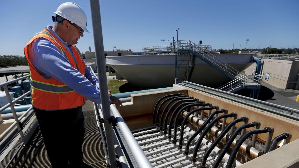 General Manager Rich Nagel explains how the microfiltration process works at the West Basin Municipal Water District water recycling facility in El Segundo.