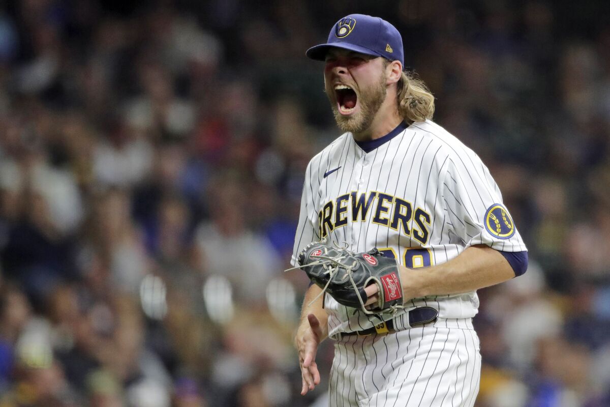 Milwaukee Brewers' Corbin Burnes reacts after striking out a batter.