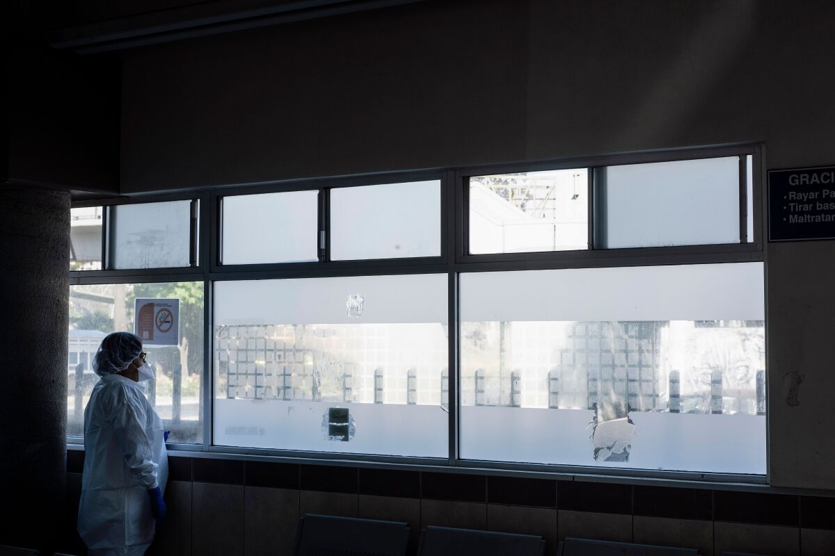 A doctor looks throught a window at Tijuana General Hospital, in Tijuana, Baja California state, Mexico, on May 7, 2020, amid the coronavirus pandemic.