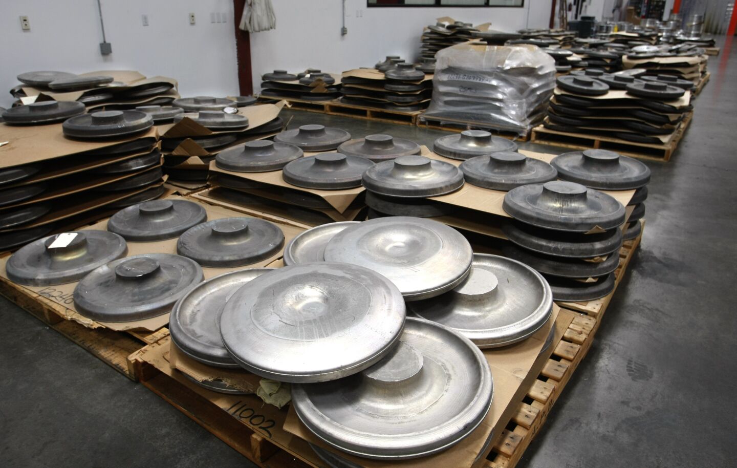 Aluminum wheel blanks in the HRE Performance Wheels manufacturing plant.