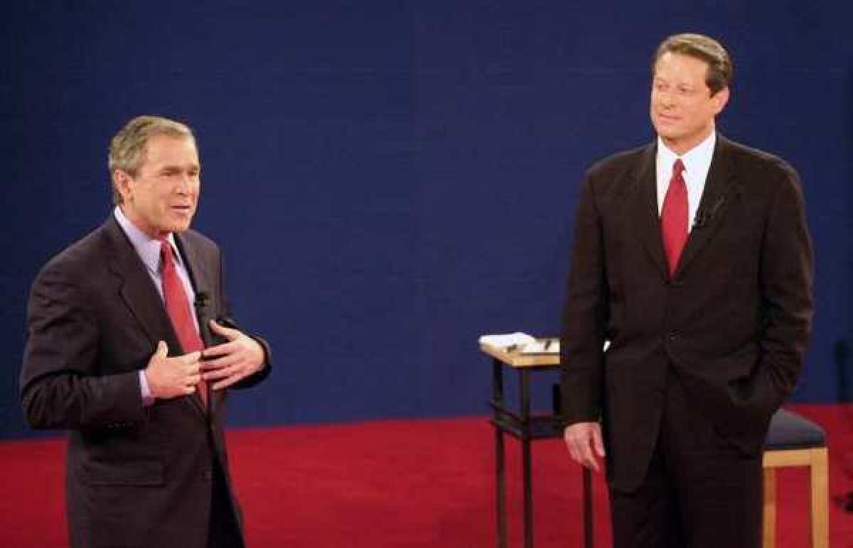 Vice President Al Gore, right, was surging in the polls in September 2000, but his performance in debates with George W. Bush didn't win him many votes. Here he debates Bush on Oct. 17, 2000, in St. Louis.