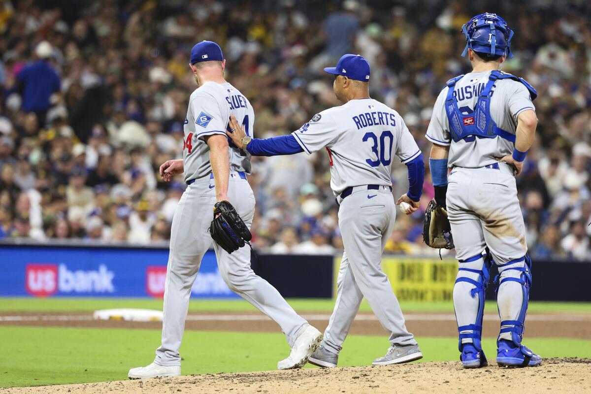 Matt Sauer is removed from Tuesday's game by manager Dave Roberts.