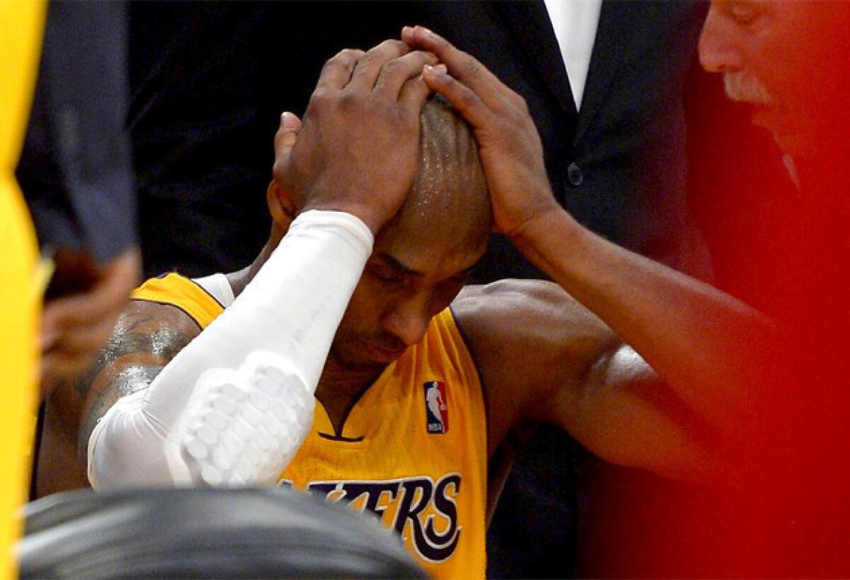 Lakers guard Kobe Bryant will be out the next six to nine months with a torn left Achilles.
