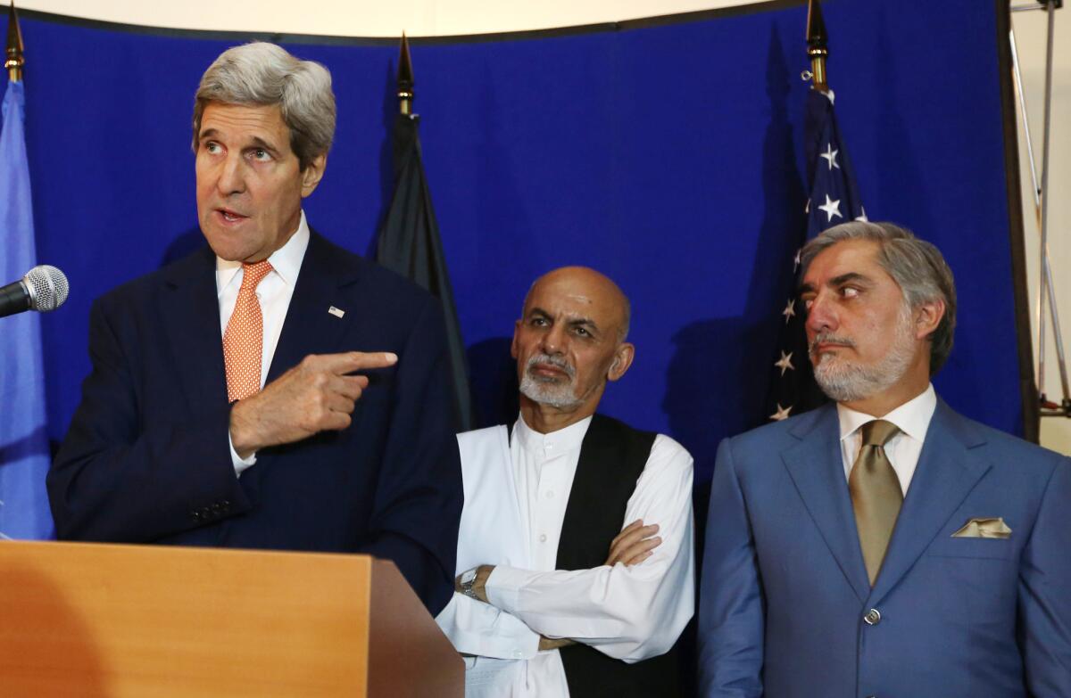 Secretary of State John F. Kerry, left, speaks as then-Afghan presidential candidates Ashraf Ghani and Abdullah Abdullah listen during a news conference in August.