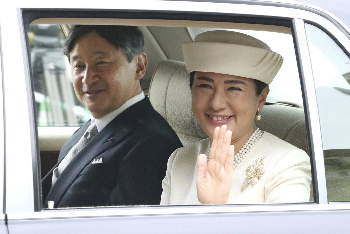 Japan's new Emperor Naruhito and Empress Masako are driven to the Imperial Palace in Tokyo on May 1, 2019. Naruhito ascended the Chrysanthemum Throne, succeeding his father, Emperor Emeritus Akihito, who abdicated the day before.