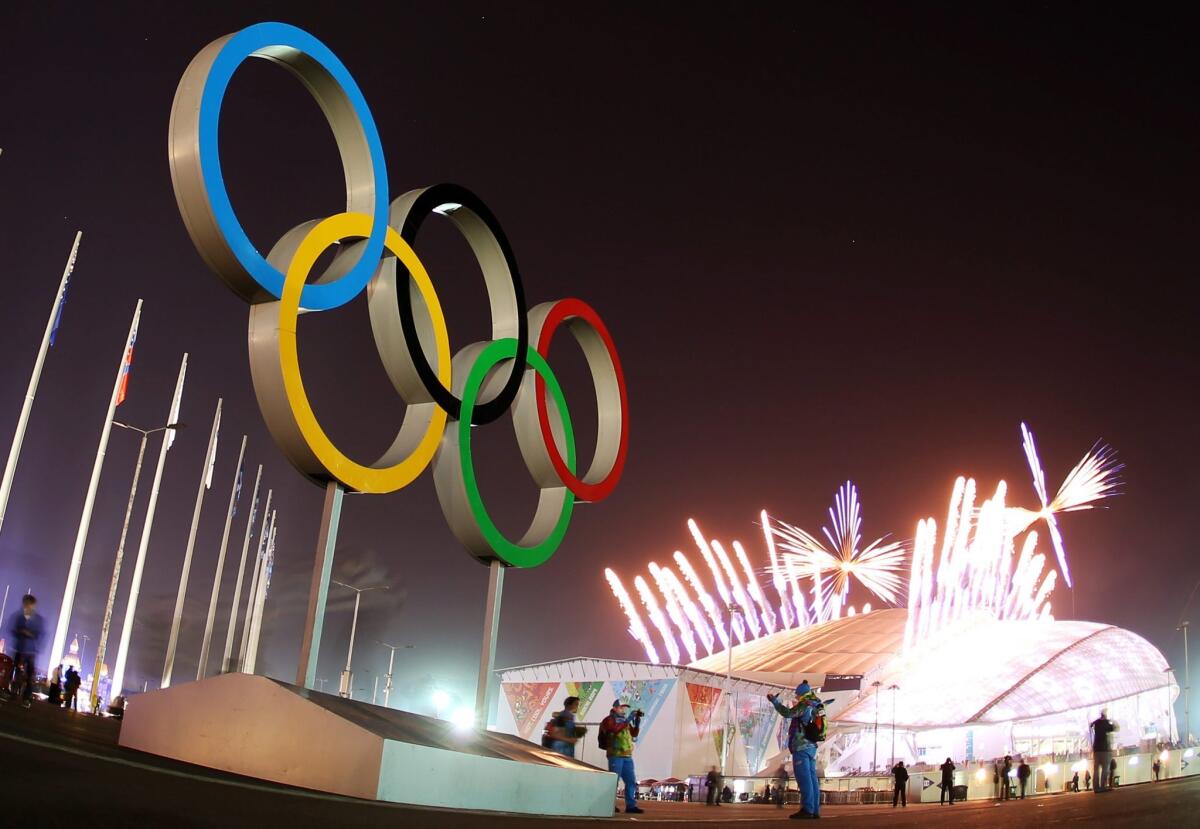 The Olympic Rings are seen as fireworks explode during the closing ceremony in Fisht Olympic Stadium.
