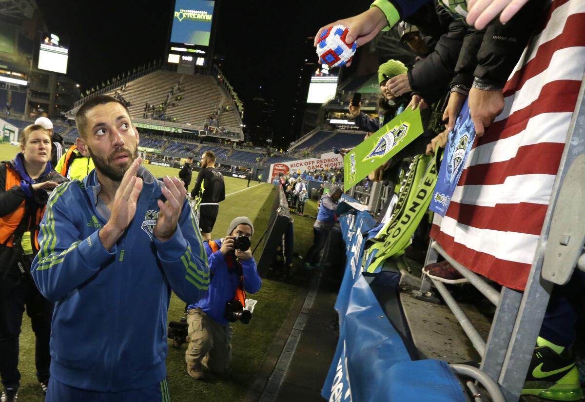 Sounders forward Clint Dempsey applauds fans as he leaves the pitch after Seattle beat FC Dallas, 2-1, in the MLS Western Conference semifinals on Nov. 1.