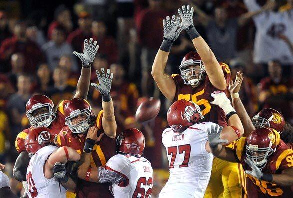 USC lineman Matt Kalil rises to block a field-goal attempt by Utah in the final seconds on Saturday night at the Coliseum.