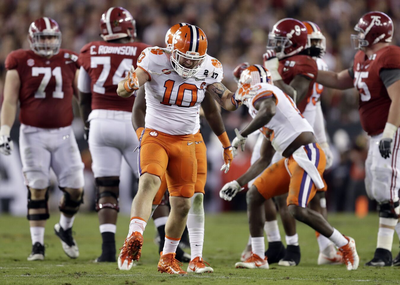 Clemson linebacker Ben Boulware celebrates with a teammate after stopping Alabama running back Bo Scarbrough for no gain during the second quarter.