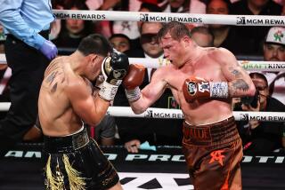 LAS VEGAS, NEVADA - SEPTEMBER 14: Saul Canelo Alvarez (R) punches Edgar Berlanga.