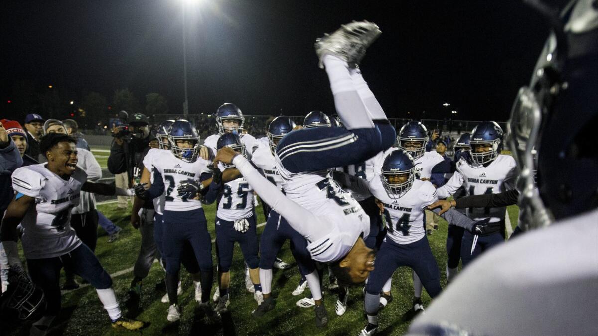 Sierra Canyon wide receiver Chayce Edwards-Morgan (22) does a backflip while celebrating with his team.