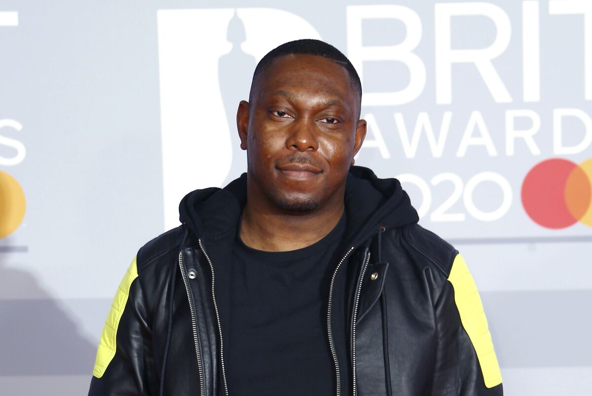 FILE - In this Tuesday, Feb. 18, 2020 file photo, Dizzee Rascal poses for photographers upon arrival at the Brit Awards 2020 in London. The Metropolitan Police said late Monday Aug. 2, 2021, rapper Dizzee Rascal was charged with assault after an incident in London that left a woman with minor injuries. (Photo by Joel C Ryan/Invision/AP, File)
