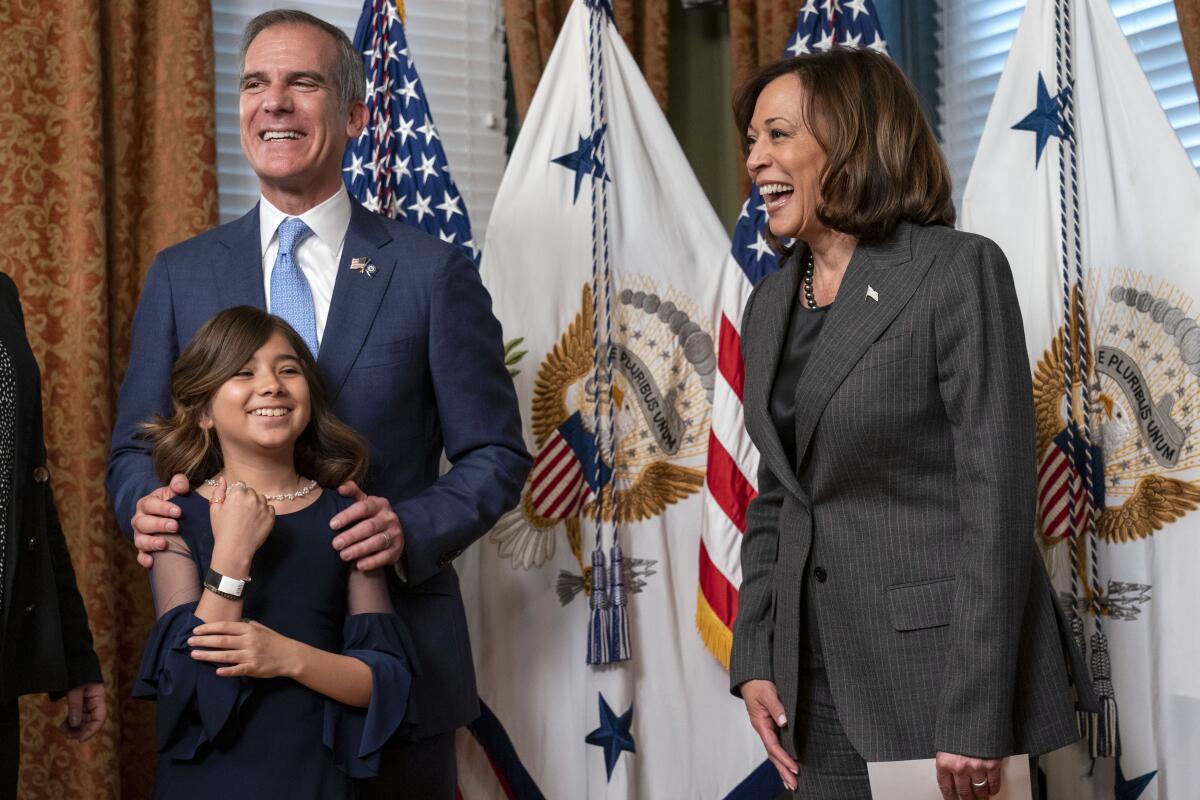 Eric Garcetti with his daughter Maya and Vice President Kamala Harris.