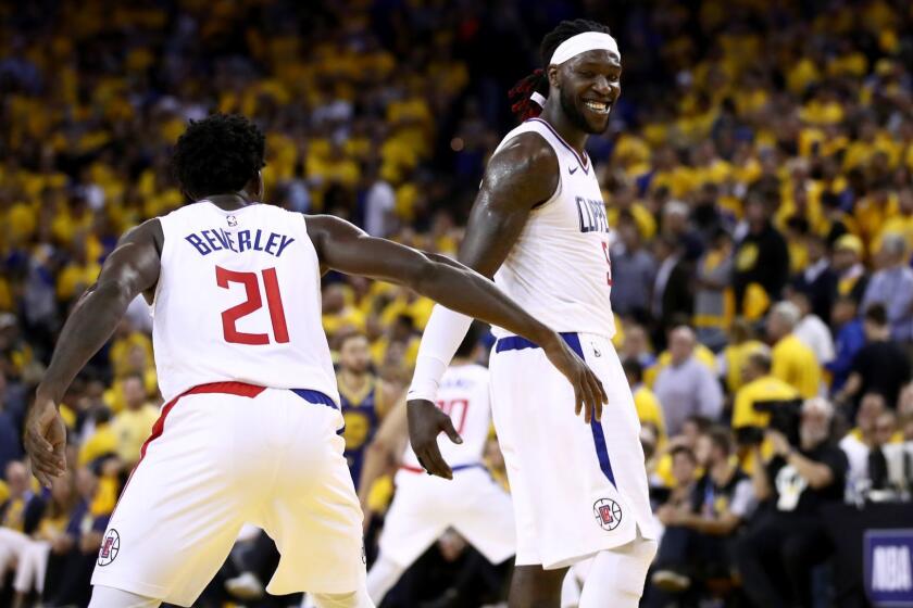 OAKLAND, CALIFORNIA - APRIL 24: Montrezl Harrell #5 shakes hands with Patrick Beverley #21 of the LA Clippers during their game against the Golden State Warriors in Game Five of the first round of the 2019 NBA Western Conference Playoffs at ORACLE Arena on April 24, 2019 in Oakland, California. NOTE TO USER: User expressly acknowledges and agrees that, by downloading and or using this photograph, User is consenting to the terms and conditions of the Getty Images License Agreement. (Photo by Ezra Shaw/Getty Images) ** OUTS - ELSENT, FPG, CM - OUTS * NM, PH, VA if sourced by CT, LA or MoD **